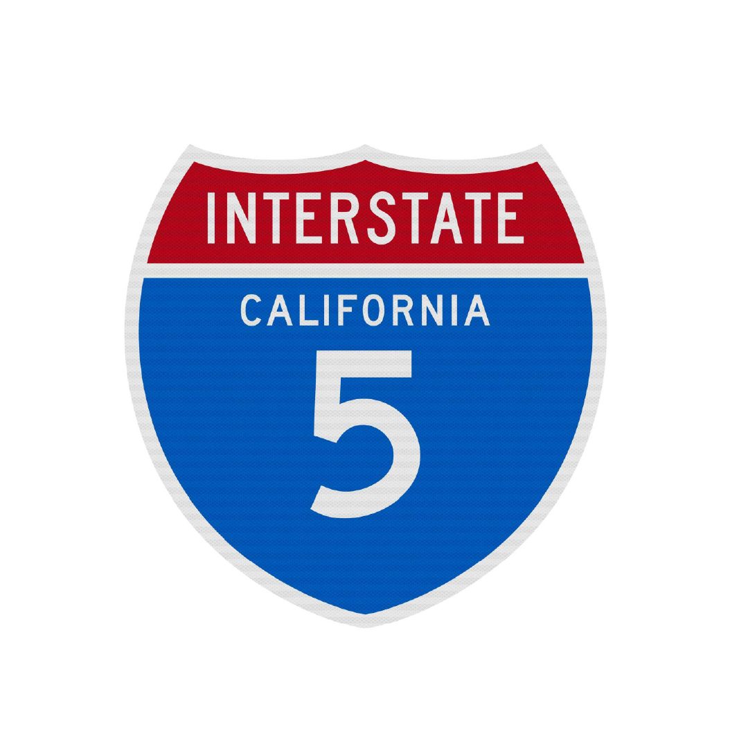 Interstate 5 highway sign with a red top labeled "Interstate" and blue bottom with "California 5" in white text.