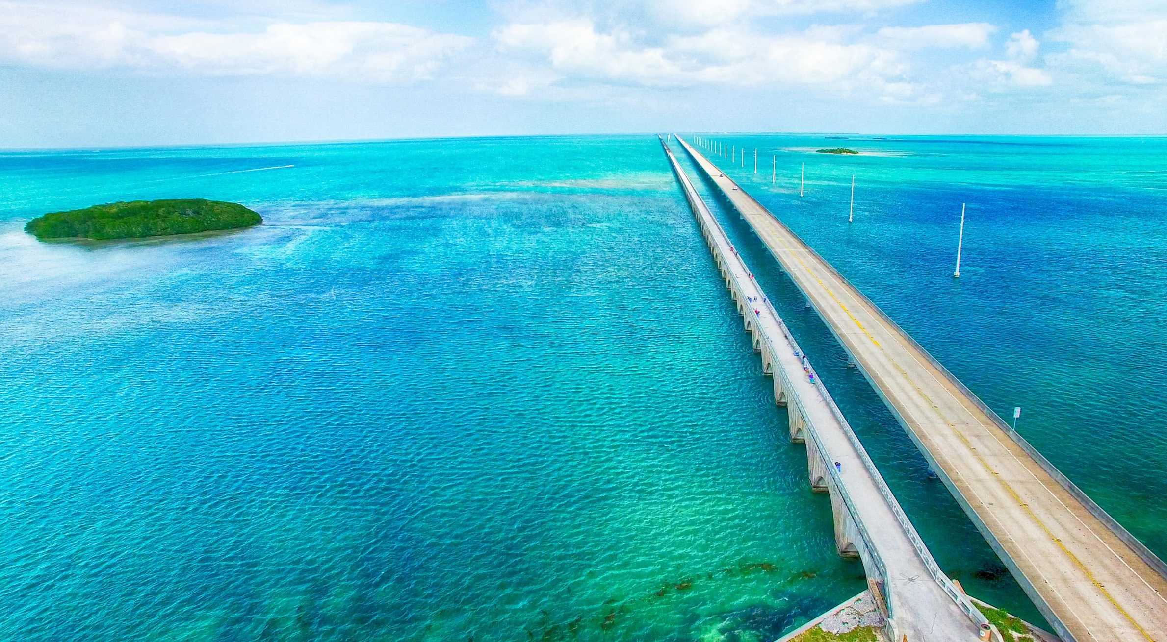 A long bridge stretches across clear turquoise water on the Florida Overseas Highway.