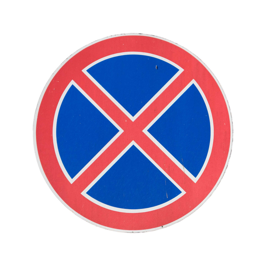 A circular traffic sign with a red border and blue center featuring a red diagonal cross for 'no stopping'.