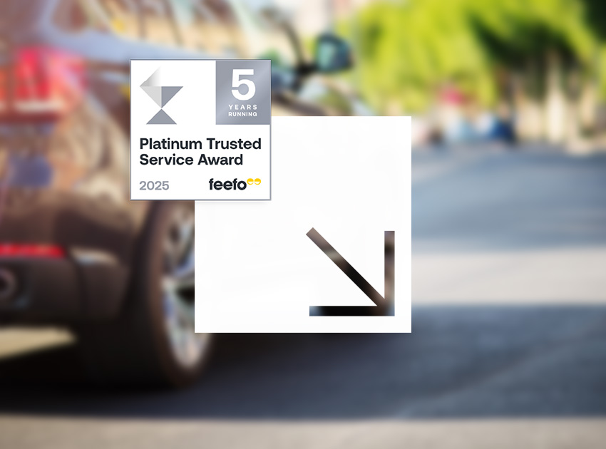 Car on a sunny street with a Feefo Platinum Trusted Service Award badge, promoting trusted car hire excess insurance providers.