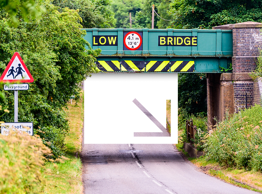 Road with a "Low Bridge" sign.